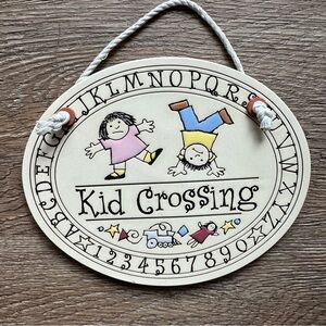 Kid Crossing Sign with Playful Characters